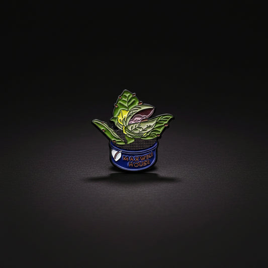 Enamel pin of a small Audrey II, our favorite man -eating plant from the cult classic Little Shop of Horrors.